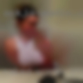 Naked woman standing table